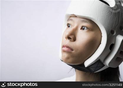 Close-up of a young woman wearing a sports helmet