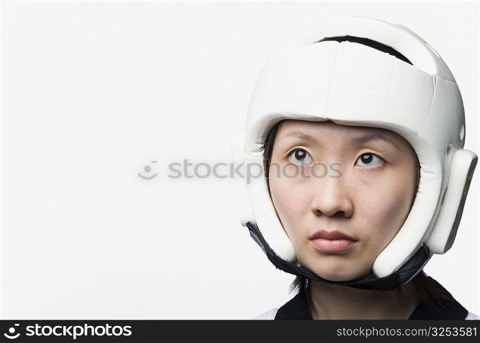 Close-up of a young woman wearing a sports helmet