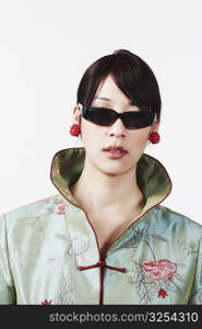 Close-up of a young woman wearing sunglasses