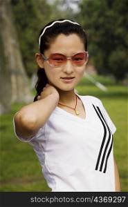 Close-up of a young woman wearing sunglasses, Qufu, Shandong Province, China
