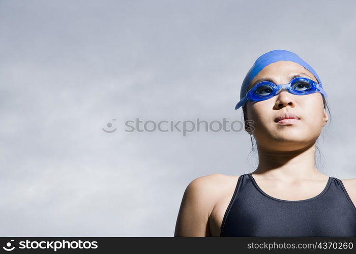 Close-up of a young woman wearing swimming goggles