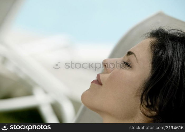 Close-up of a young woman with closed her eyes