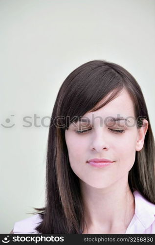 Close-up of a young woman with her eyes closed