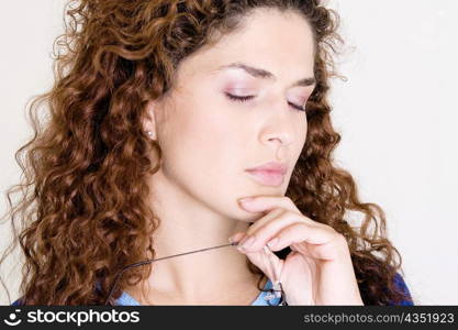 Close-up of a young woman with her eyes closed