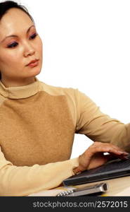 Close-up of a young woman working on a laptop