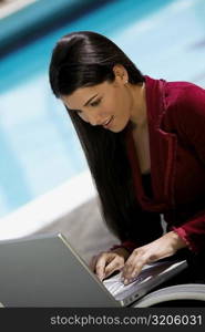 Close-up of a young woman working on a laptop