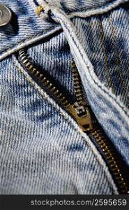 Close-up of a zipper on a pair of jeans