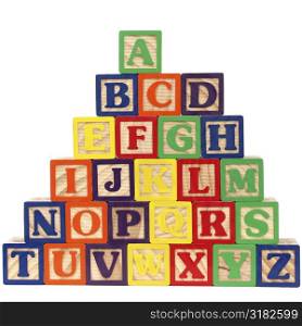 Close-up of ABC blocks A-Z on white background.