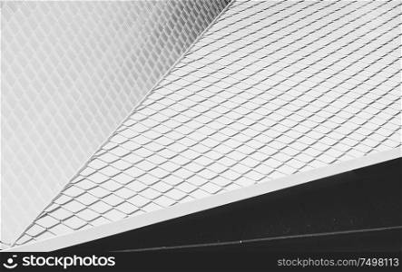 Close up of abstract geometric structure white wall and rooftop