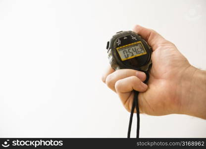 Close-up of adult male hand holding stopwatch.