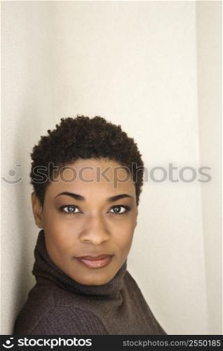 Close up of African-American woman looking at viewer.