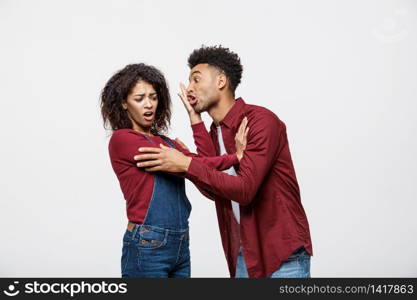 Close-up of African American young couple deny kissing over white background studio.. Close-up of African American young couple deny kissing over white background studio