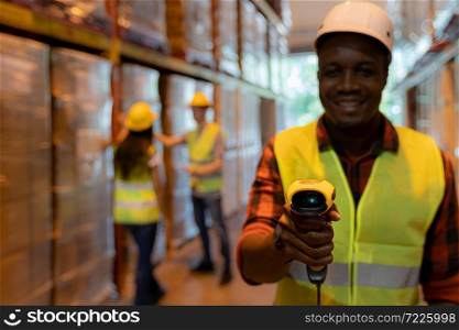 Close up of african black woman warehouse worker hold hand scanner to check inventory stock in distribution warehouse. Traceability FIFO LIFO inventory just in time and warehouse concept photo.