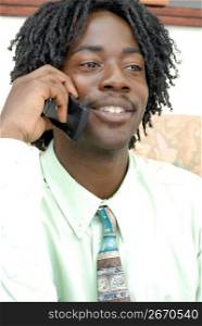 Close up of African man with dreadlocks talking on cell phone