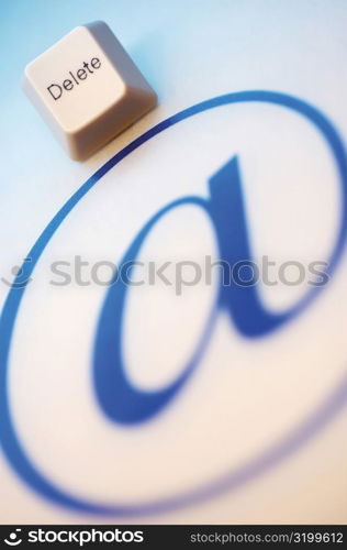 Close-up of an &acute;at&acute; symbol with a computer key