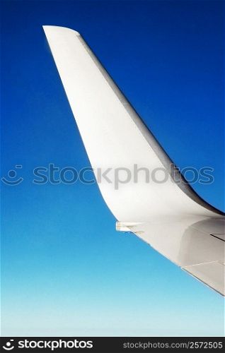 Close-up of an airplane wing in flight