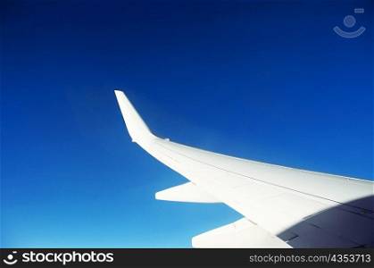Close-up of an airplane wing in flight