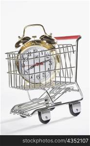 Close-up of an alarm clock in a shopping cart