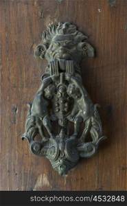 Close-up of an antique door knocker, Montepulciano, Siena, Tuscany, Italy