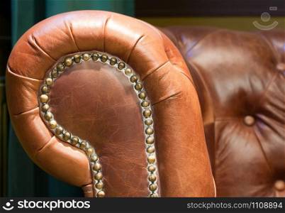 Close-up of an antique leather retro chair