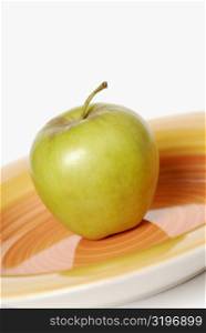 Close-up of an apple on a tray