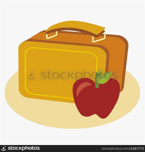 Close-up of an apple with a lunch box