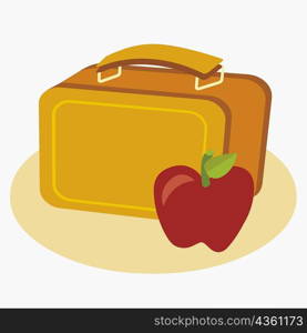 Close-up of an apple with a lunch box