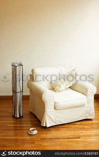 Close-up of an armchair on a wooden floor