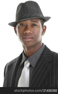 Close up of an attractive young man in pinstripe suit and hat.