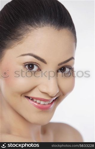 Close-up of an attractive young woman over white background