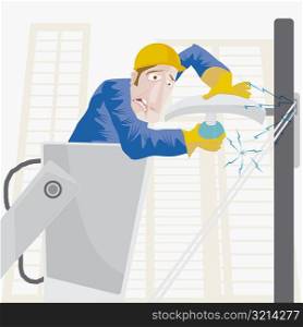 Close-up of an electrician getting an electric shock