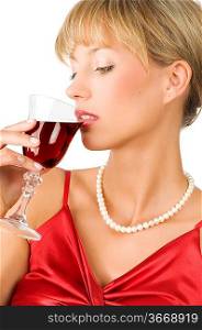 close up of an elegant blond girl with necklace drinking red wine