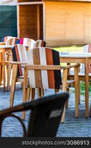 Close up of an empty table with empty chairs at a local outdoor resturant. Alba Iulia, Romania, 2021. Close up of an empty table with empty chairs at a local outdoor resturant. Alba Iulia, Romania, 2021