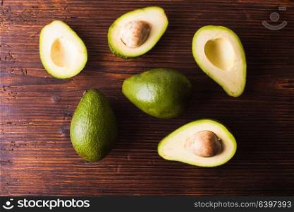 Close-up of an juicy organic avocado on wooden table. Healthy food concept
