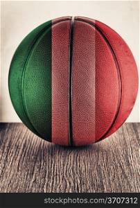 Close up of an old leather basketball with Italian flag