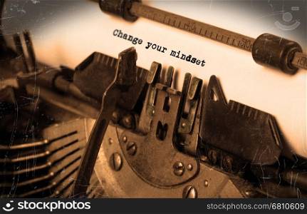Close-up of an old typewriter with paper, perspective, selective focus, change your mindset