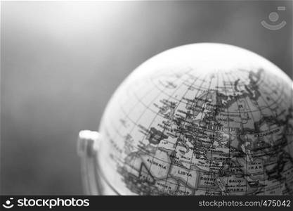 Close up of an old vintage globe, blurry background