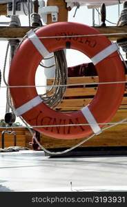 Close-up of an orange life belt on a yacht