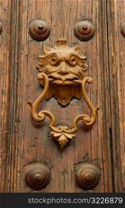 Close-up of an ornate brass door knocker on a door, Havana, Cuba