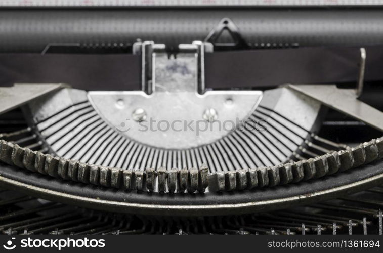 Close up of antique typewriter typebars with focus on the at symbol, great concept for blogs, journalism, news or the mass media