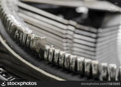 Close up of antique typewriter typebars with focus on the at symbol, great concept for blogs, journalism, news or the mass media