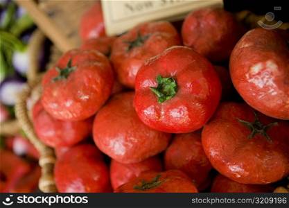 Close-up of artificial tomatoes in a basket