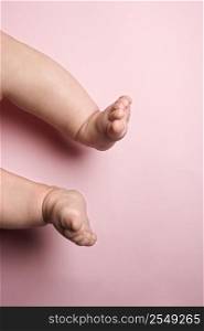 Close up of Asian babys legs and feet.
