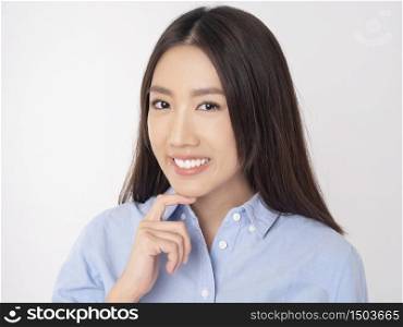 Close up of Asian woman with beautiful teeth on white background