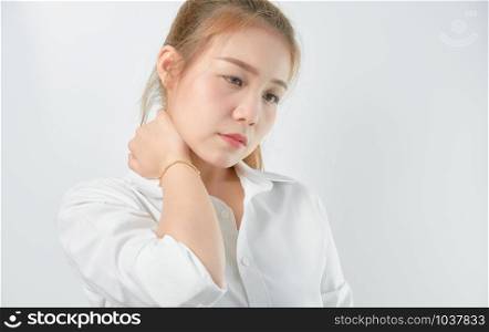 Close-up of Asian women acute pain in a neck, Health care and medical concept. gray background.