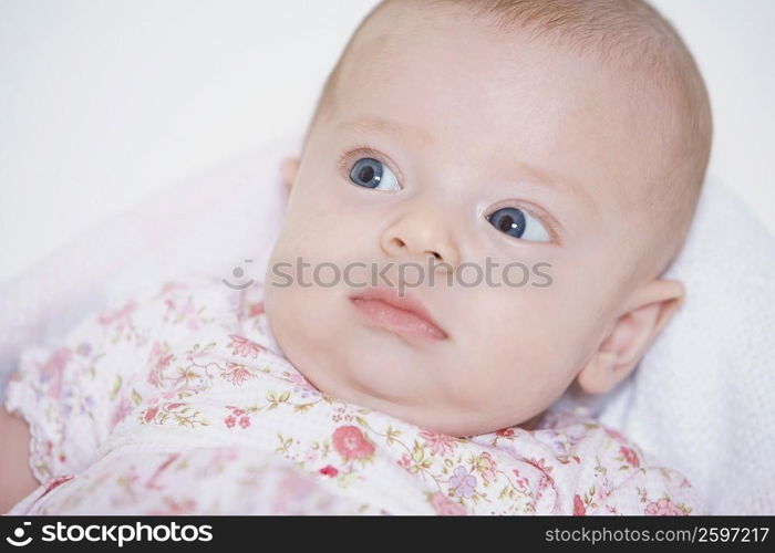 Close-up of baby girl looking sideways