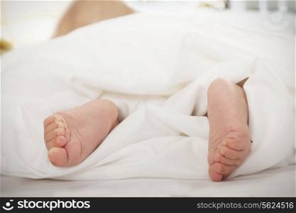 Close-up of baby&rsquo;s feet in the blanket