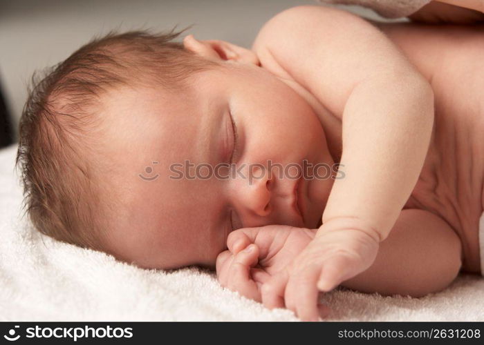 Close Up Of Baby Sleeping On Towel