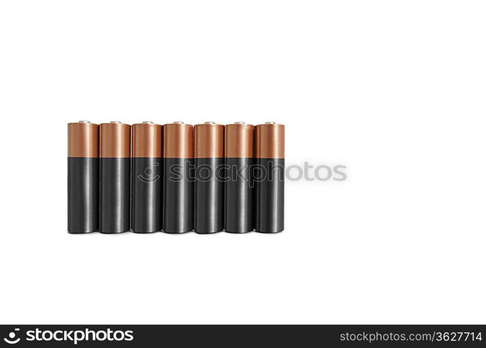 Close-up of batteries in a row over white background