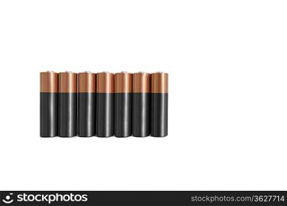 Close-up of batteries in a row over white background